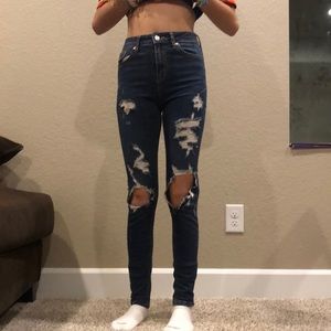 Ripped tight blue jeans